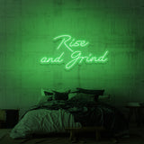 Illuminated advertisement "RISE AND GRIND". 