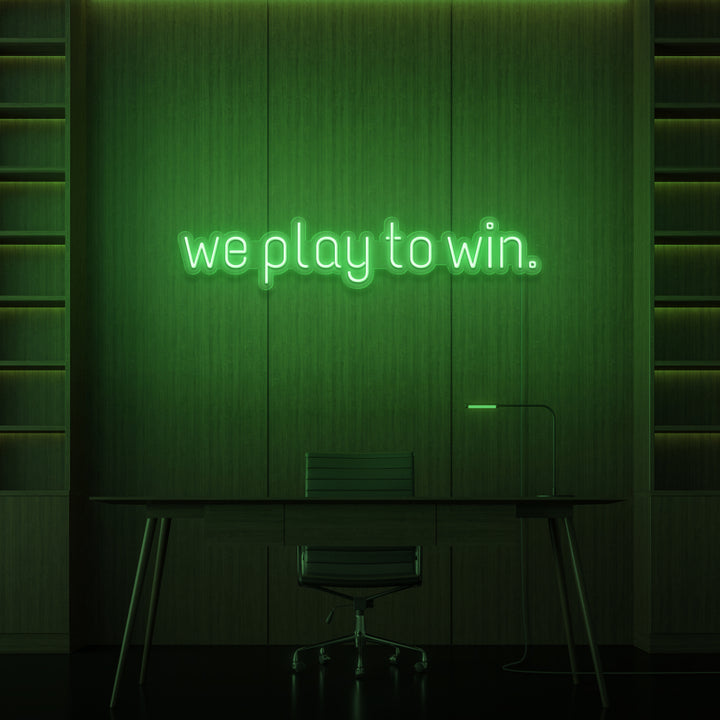 "WE PLAY TO WIN." NEON SKILT