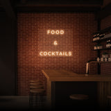 Leuchtreklame „Essen &amp; Cocktails“. 
