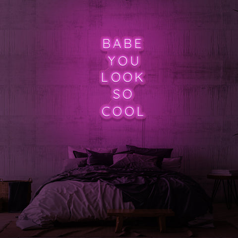 Neon sign "Babe, you look so cool". 